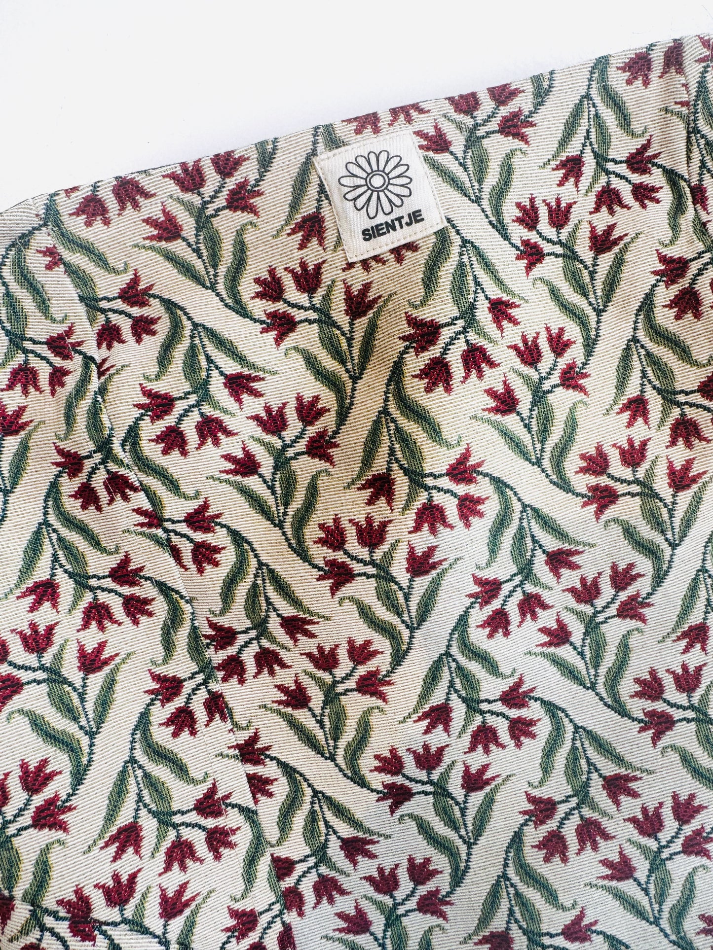 Reversible corset in donkergroen en tulpen stof