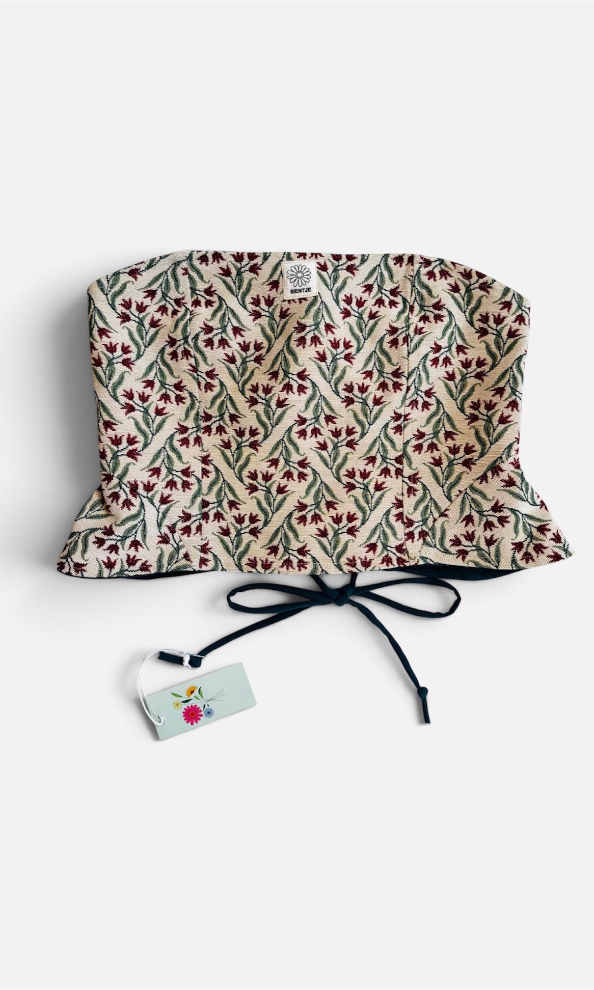 Reversible corset in donkergroen en tulpen stof