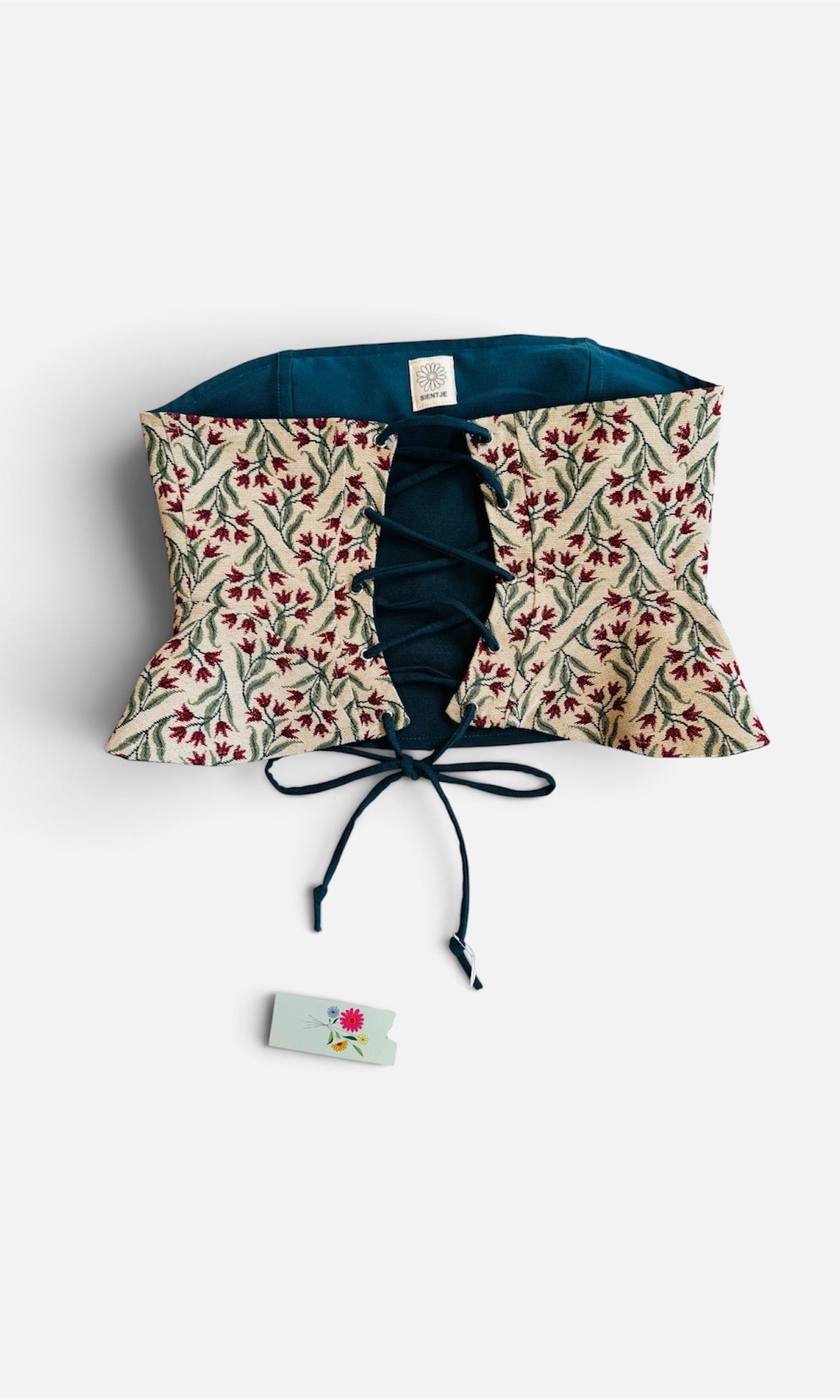 Reversible corset in donkergroen en tulpen stof